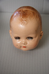 Doll's head, Esther's or Kathy's. Probably celluloid
