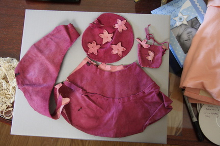 Doll outfit: hand-made suede skirt, cap, purse and cape.
