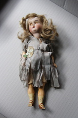 Jointed porcelain and composition doll, blue silk dress