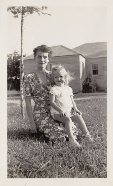 1941: Esther with Kathy in her lap in front of Sharyland home.