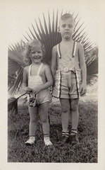 1941, May: Kathy with a little leather purse and Wally F with bandaged chin.