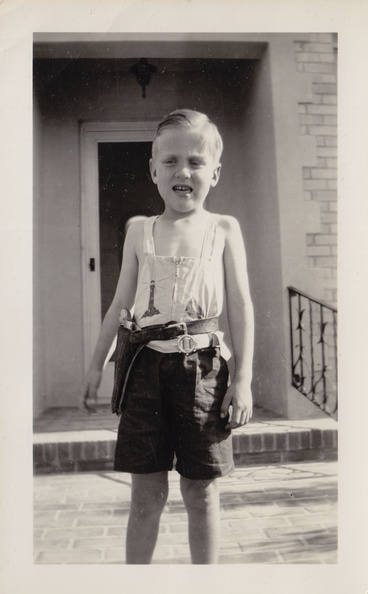1941, October: Wally F in his cowboy outfit in front of Sharyland home.