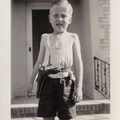 1941, October: Wally F in his cowboy outfit in front of Sharyland home.