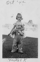 1942, October: Kathy with her arms around Tom Moore