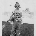 1942, October: Kathy with her arms around Tom Moore