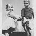1943, February: Kathy and Wally F on locomotive bell