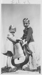 1943, February: Kathy and Wally having fun ringing the train bell