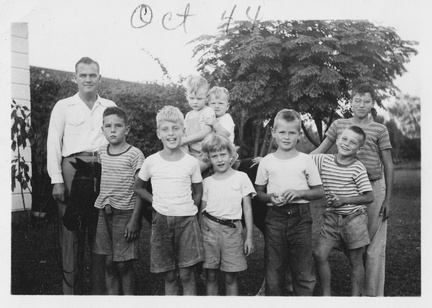 1944, October: Lewis and kids with the pony