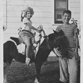1944, October: Kathy on a pony with unknown boy