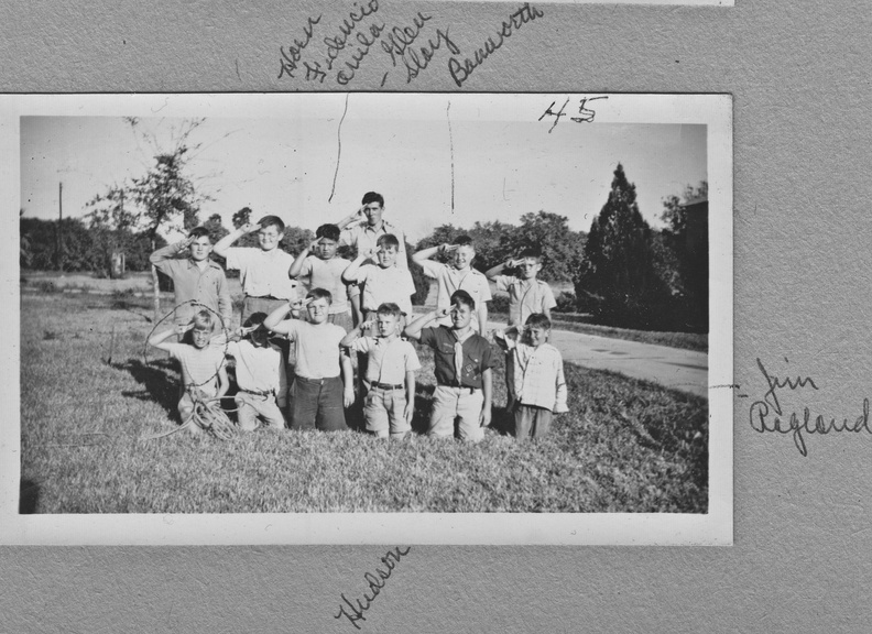1945: Boy scouts saluting