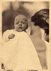 1936, April?: Little Wally is awake and being burped?