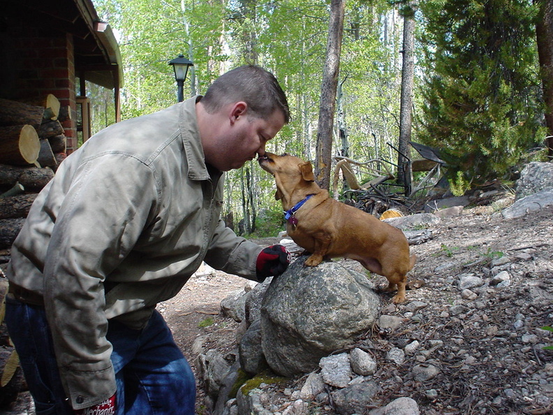 Priscilla giving Jerry a kiss as he stacks wood at the woodpile. There is a pile of old furniture and belongings stacked behind them. After generations of no trash service and the dump being 20 minutes away, we accumulated a lot. The only thing the rental agent told us to do was to clear the house out. I still regret some of my choices, but it had to be done if we wanted to rent the place. DSC02840.jpg