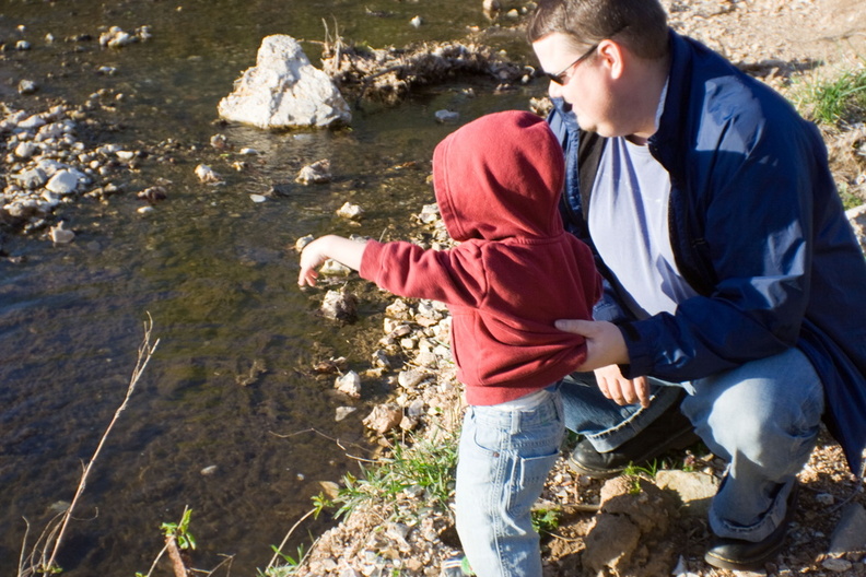 Daddy keeps Wally from falling in.