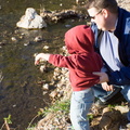 Daddy keeps Wally from falling in.