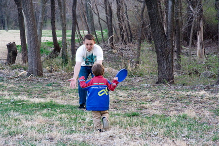 Wally runs the frisbee to Brian.