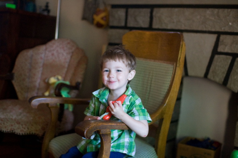 Wally tries out GGma's rocking chair and finds it to his liking.